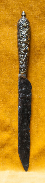 A 16th C. knife with a superbly decorated brass handle.