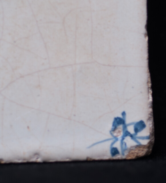 A 17th C. Delft blue tile with a falling angel.