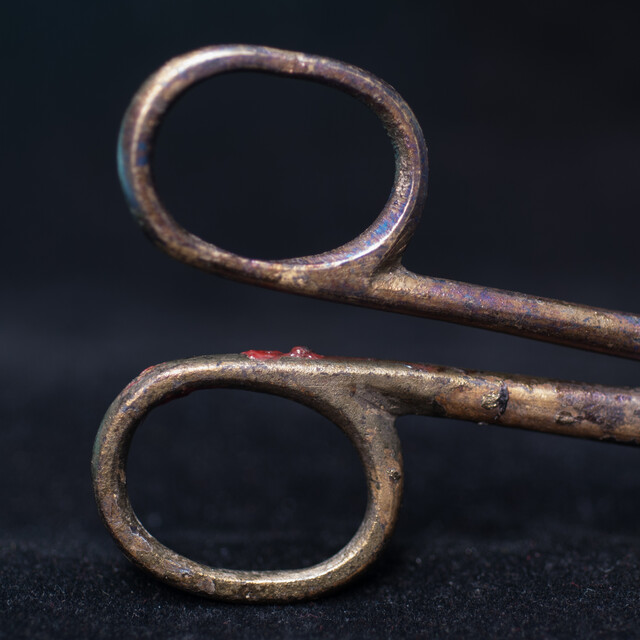 A 17th C. Dutch bronze candle snuffer.