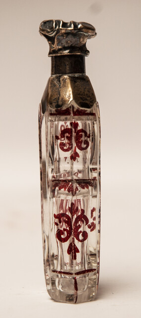A 19th C cold enamel painted perfume bottle with a silver cap.