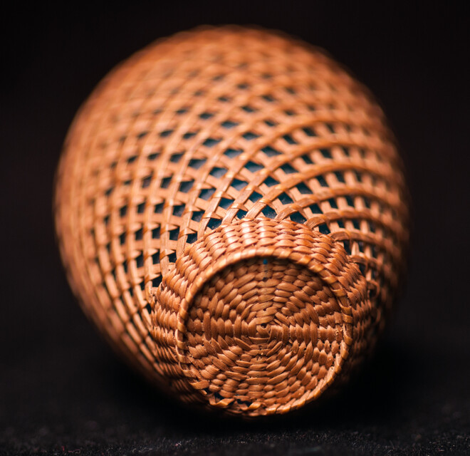 A 19th C perfume bottle covered with artful straw decoration