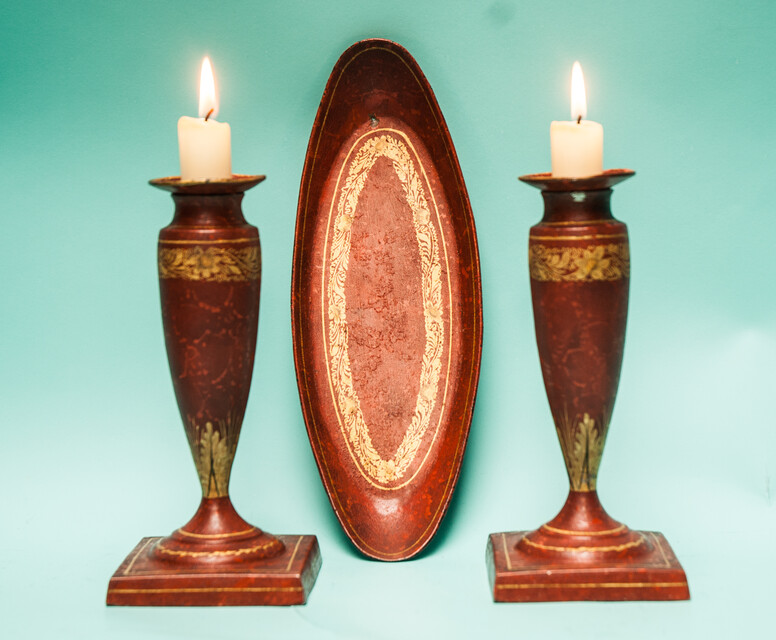 A 19th C. set of pewter candlesticks and a small oval tray, lacquered in red and gold.