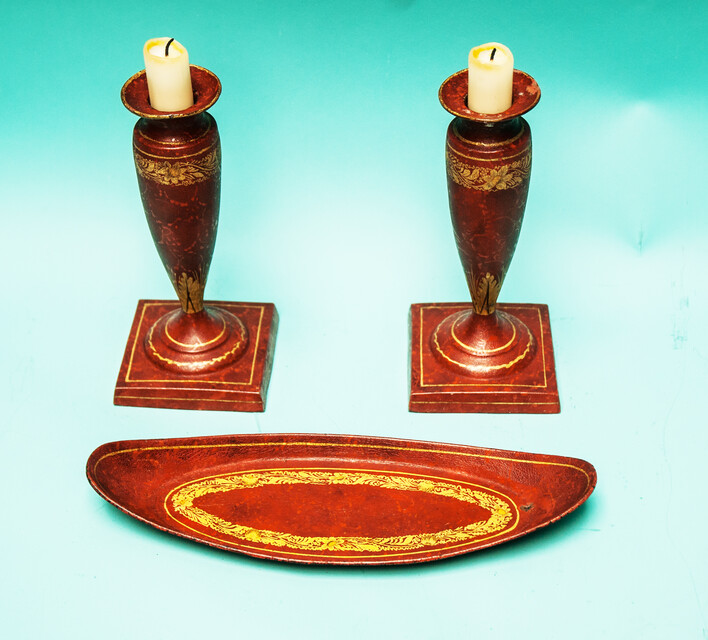 A 19th C. set of pewter candlesticks and a small oval tray, lacquered in red and gold.