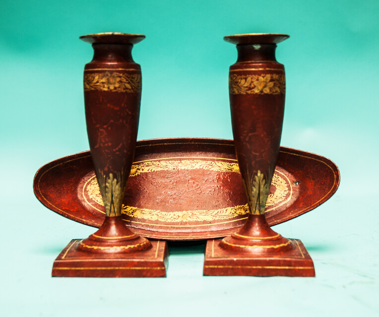 A 19th C. set of pewter candlesticks and a small oval tray, lacquered in red and gold.