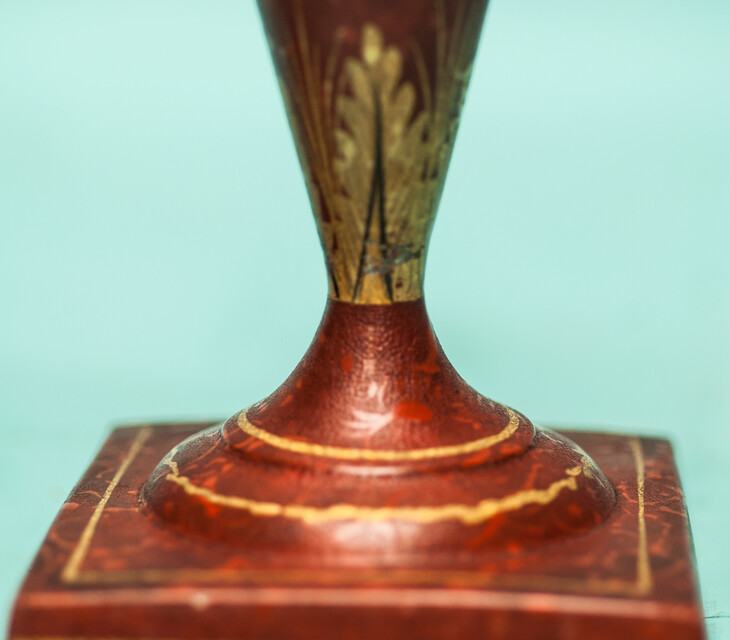 A 19th C. set of pewter candlesticks and a small oval tray, lacquered in red and gold.