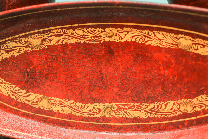 A 19th C. set of pewter candlesticks and a small oval tray, lacquered in red and gold.