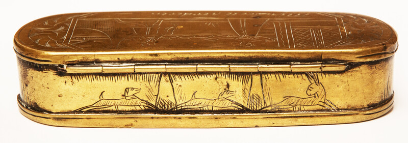 A brass 17th C. Dutch tobacco box with a naughty text.