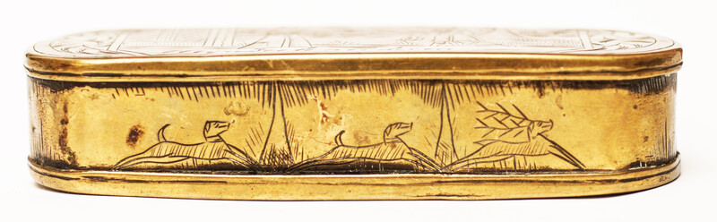 A brass 17th C. Dutch tobacco box with a naughty text.