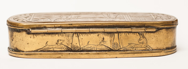 A brass 17th C. Dutch tobacco box with a naughty text.