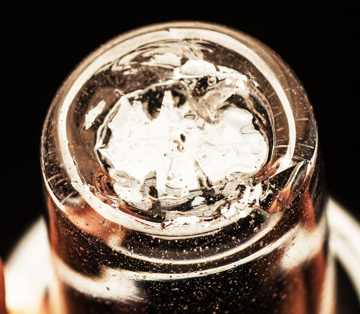 A clear eighteenth century straight glass with a folded rim and an unpolished pontil.