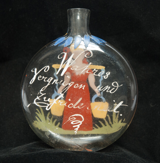A cold enamel painted  19th C. Bohemian bottle with a milk-maid and a pleasant text.