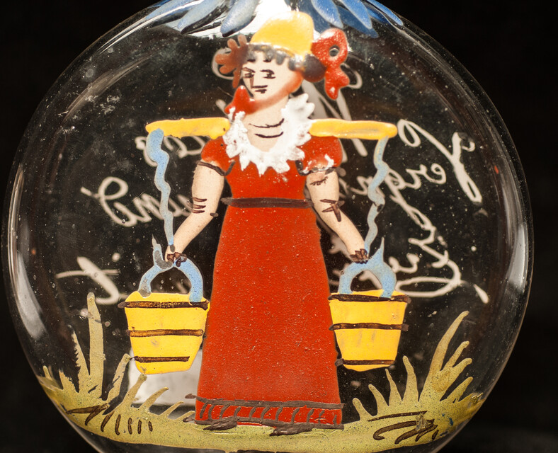 A cold enamel painted  19th C. Bohemian bottle with a milk-maid and a pleasant text.