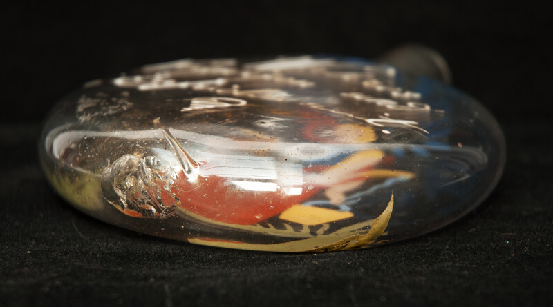 A cold enamel painted  19th C. Bohemian bottle with a milk-maid and a pleasant text.