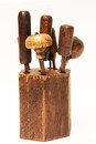 A complete set of eight engravers burins in a hexagonal wooden block.