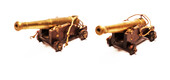 A couple of brass miniature cannons.