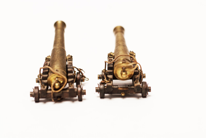 A couple of brass miniature cannons.
