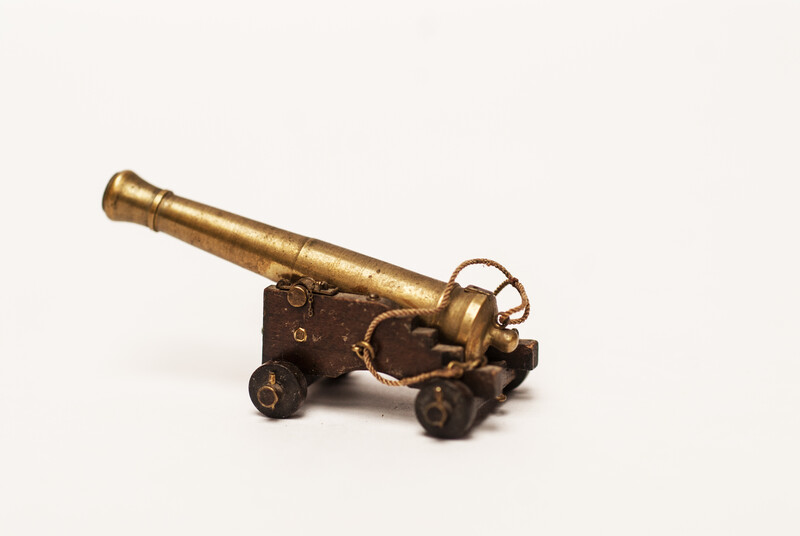 A couple of brass miniature cannons.