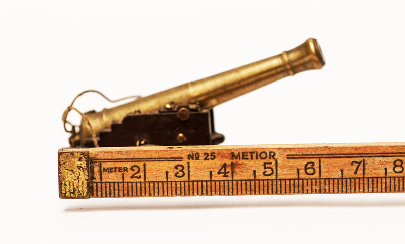 A couple of brass miniature cannons.