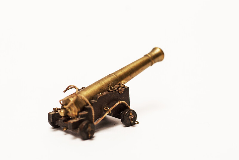 A couple of brass miniature cannons.