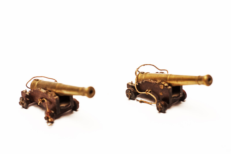 A couple of brass miniature cannons.