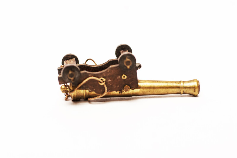 A couple of brass miniature cannons.