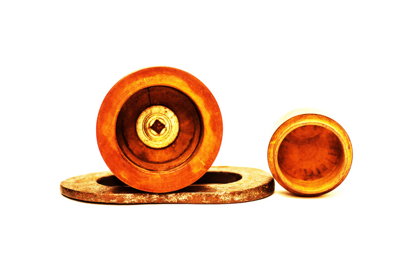 A Dutch boxwood lidded tinderbox with fire iron.