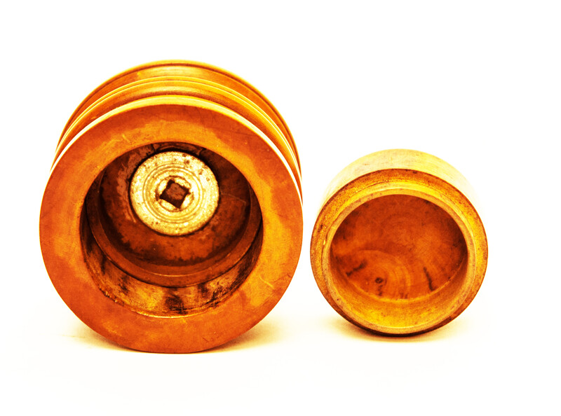 A Dutch boxwood lidded tinderbox with fire iron.