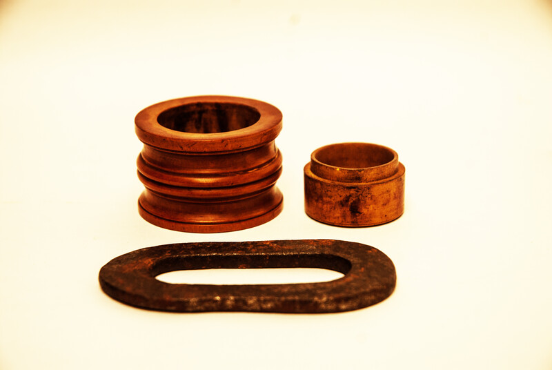 A Dutch boxwood lidded tinderbox with fire iron.