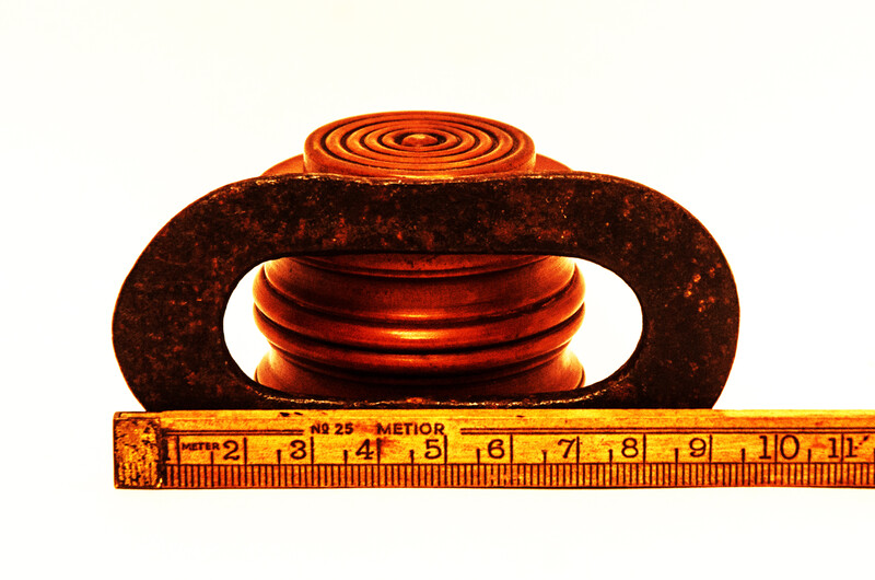A Dutch boxwood lidded tinderbox with fire iron.