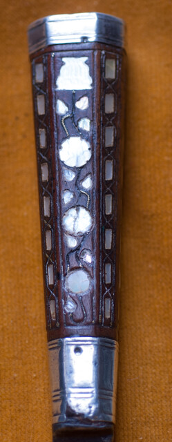 A Dutch knife with silver mountings  and mother of pearl decoration in its leather sheath dated 1776.