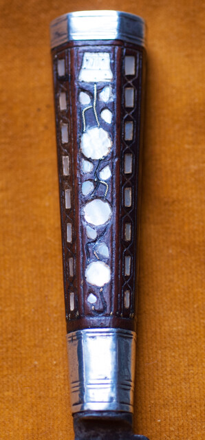 A Dutch knife with silver mountings  and mother of pearl decoration in its leather sheath dated 1776.