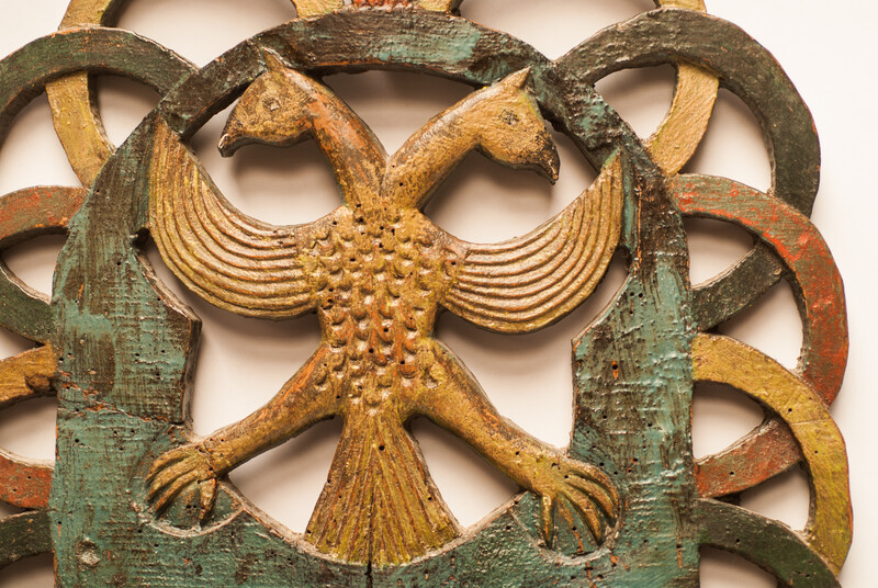 A Dutch spoonrack with 12 pewter spoons and dated 