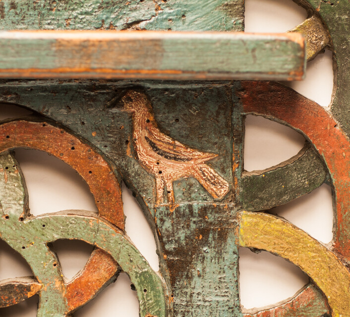 A Dutch spoonrack with 12 pewter spoons and dated 