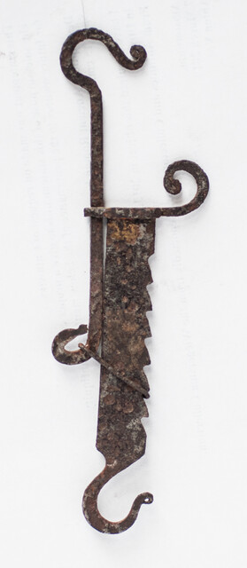A miniature 17th C. iron toy fire pull.