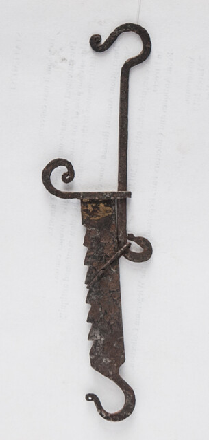 A miniature 17th C. iron toy fire pull.