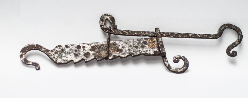 A miniature 17th C. iron toy fire pull.