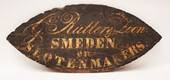 A nineteenth century Dutch shop sign of a blacksmith and lockmaker.