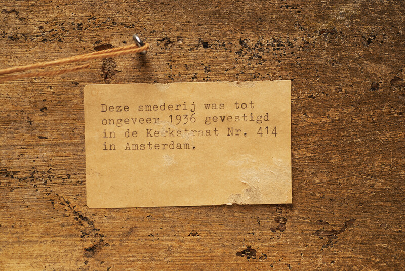 A nineteenth century Dutch shop sign of a blacksmith and lockmaker.