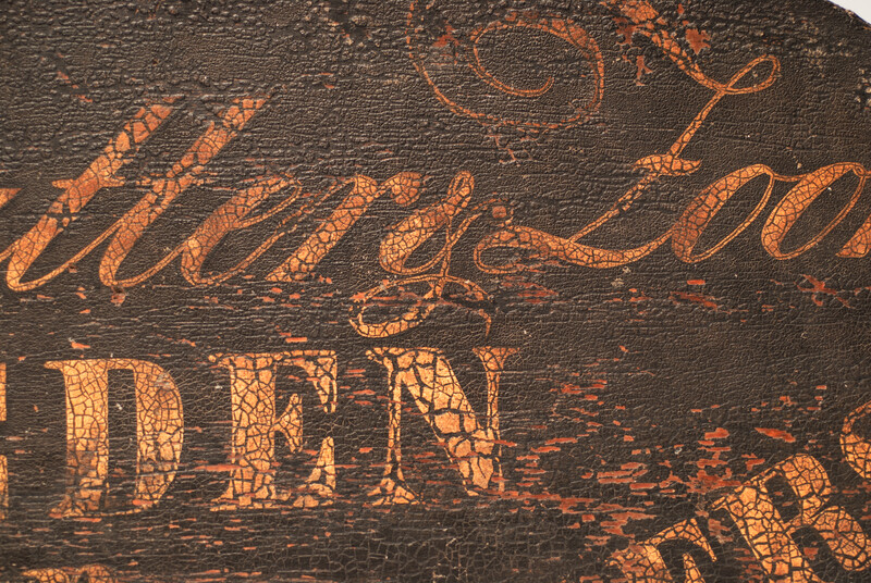A nineteenth century Dutch shop sign of a blacksmith and lockmaker.
