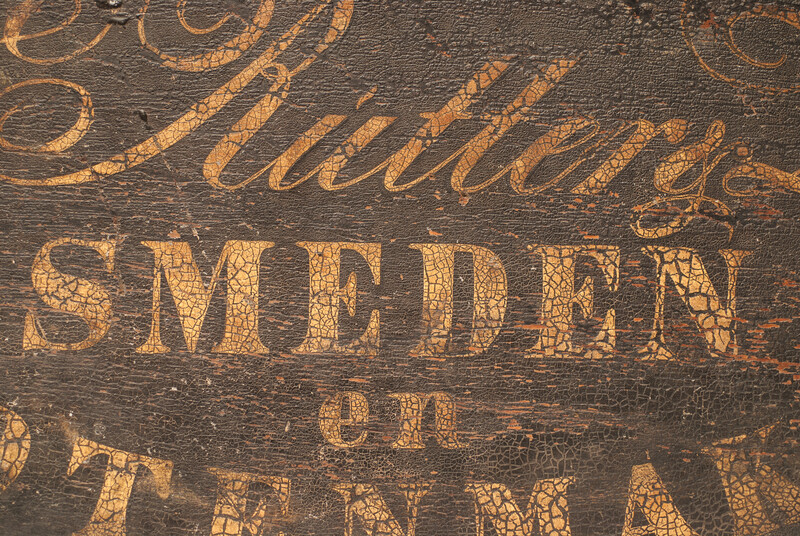 A nineteenth century Dutch shop sign of a blacksmith and lockmaker.