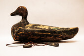 A nineteenth century Dutch wooden decoy duck with lead weights.