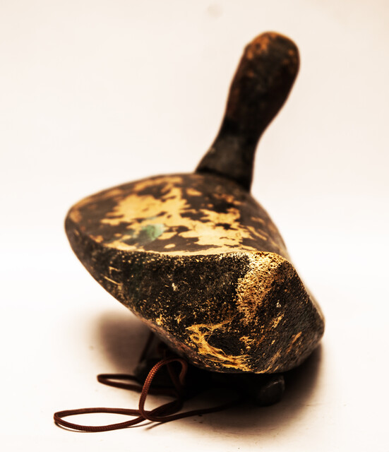 A nineteenth century Dutch wooden decoy duck with lead weights.