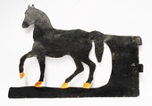 A painted eighteenth century Dutch iron weathervane in the form of a horse.