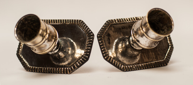 A pair of silver plated 18th Century Dutch church bench candlesticks.