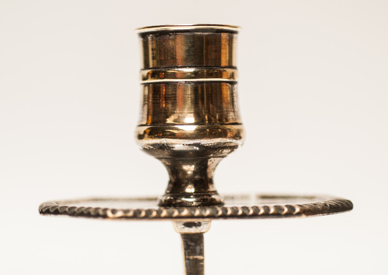 A pair of silver plated 18th Century Dutch church bench candlesticks.