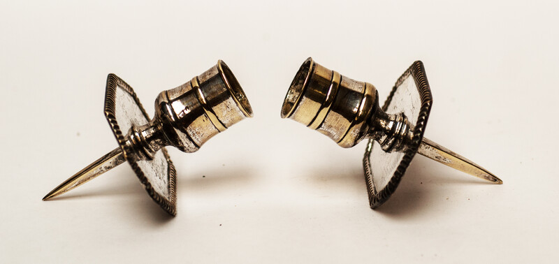 A pair of silver plated 18th Century Dutch church bench candlesticks.