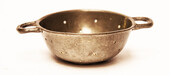 A pewter toy strainer with 18th century Dutch hallmarks.