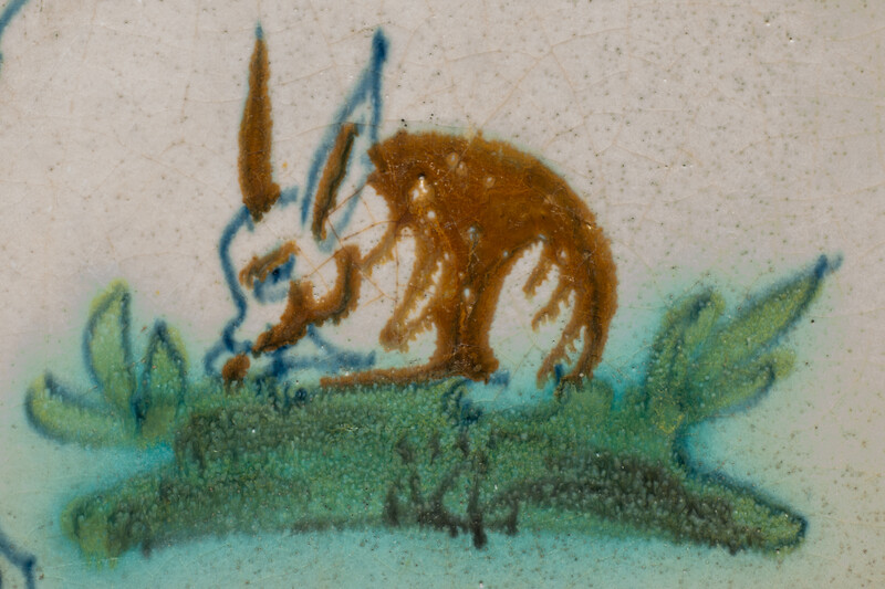 A polychrome early 17th C. tile with a rabbit.