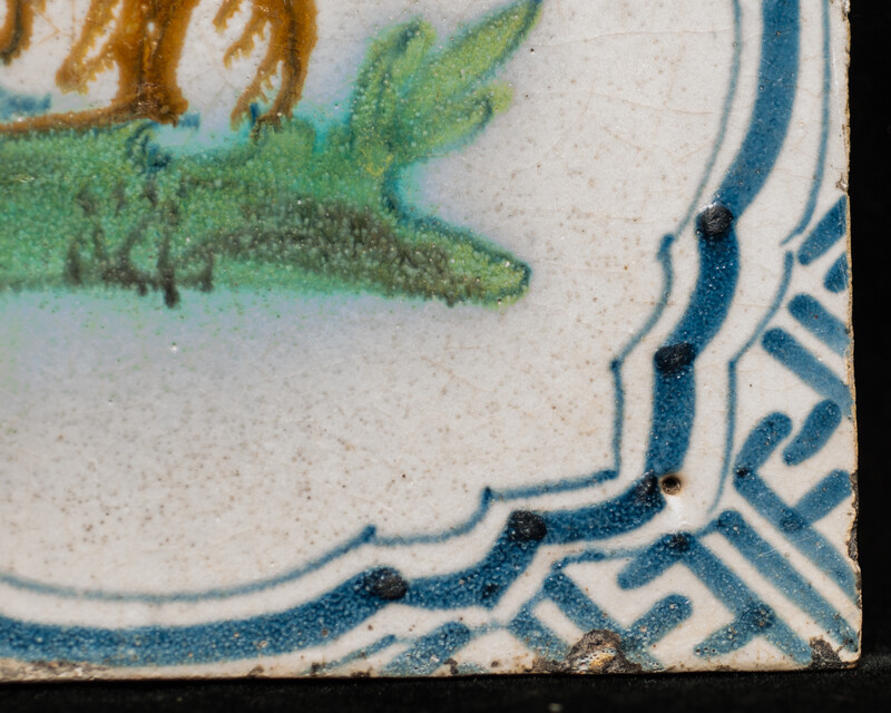 A polychrome early 17th C. tile with a rabbit.