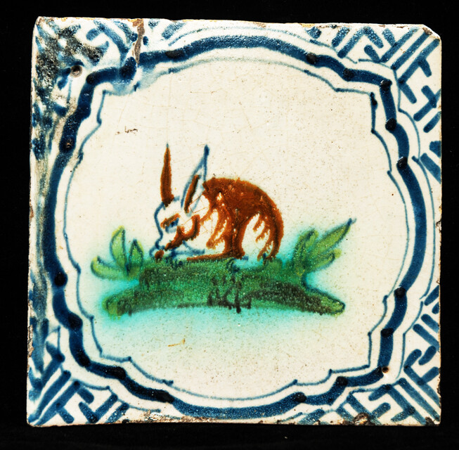 A polychrome early 17th C. tile with a rabbit.